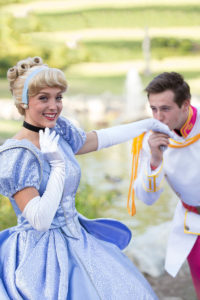 Boys and girls participating in a royal-themed party game.