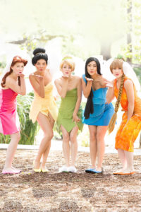 Group of princess performers posing with children at a birthday party, creating a magical experience.