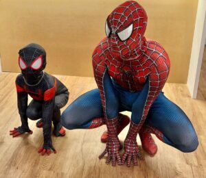 Spider-Man performer with children at a superhero-themed birthday party in Los Angeles.