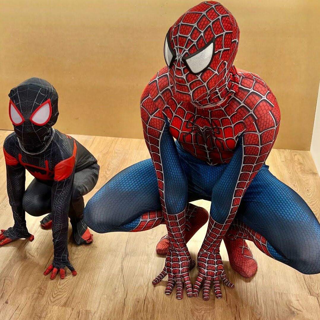 Spider-Man performer with children at a superhero-themed birthday party in Los Angeles.