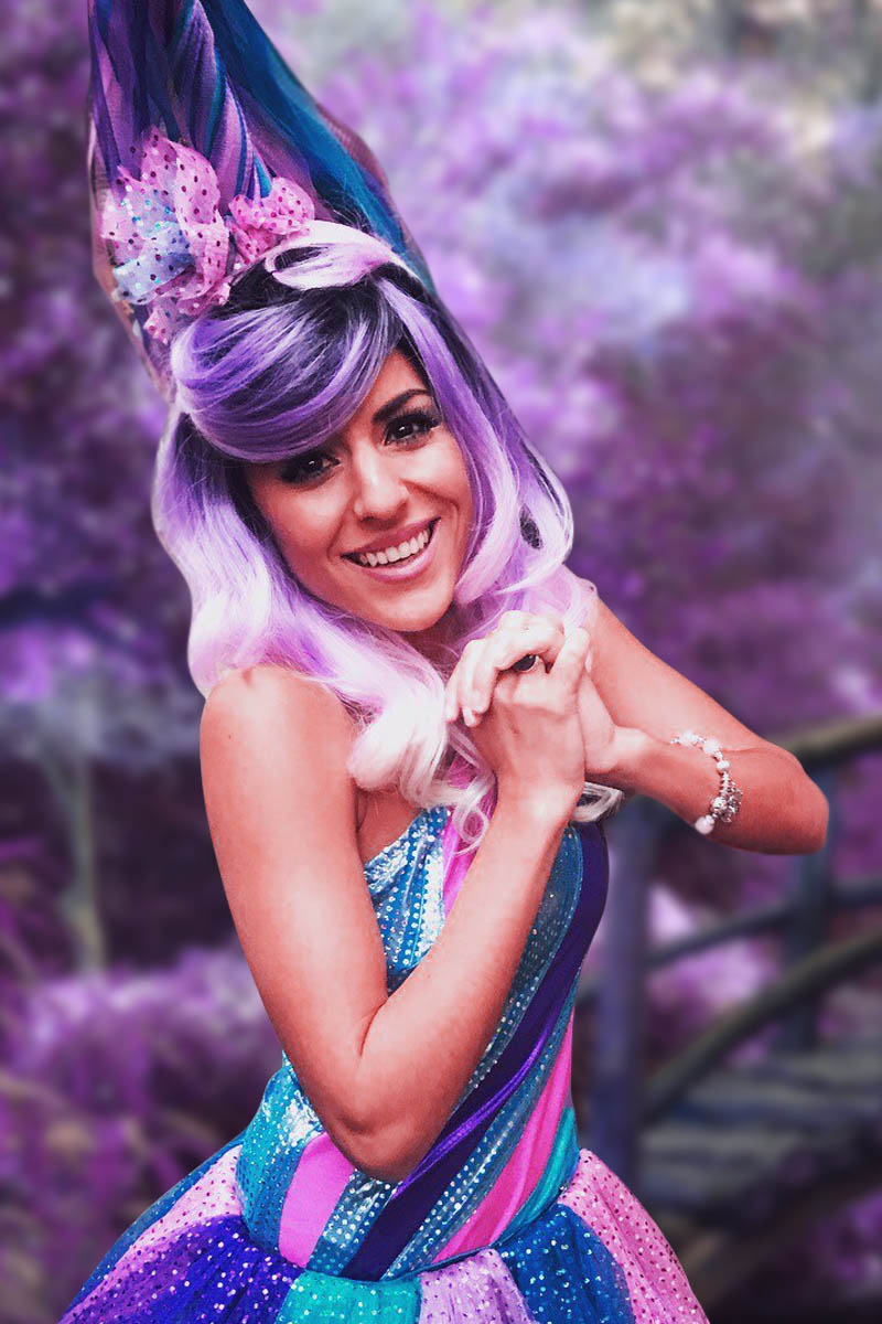 A stunning unicorn cake decorated with pastel frosting, edible glitter, and a golden horn.