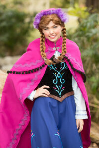 Ice Princess standing in a welcoming way with a smile on her face.
